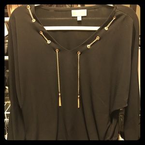 Black top with gold chain accent